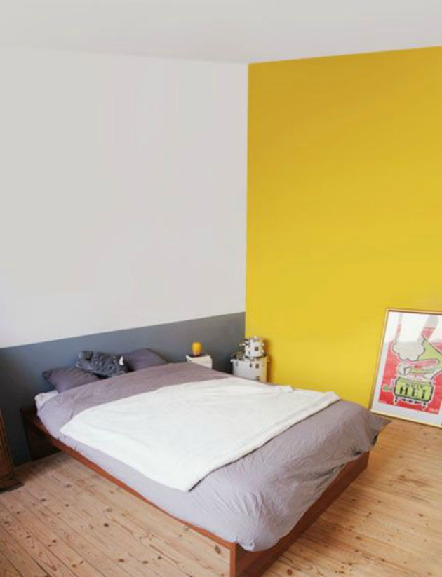Un dormitorio cálido pintado de amarillo y gris